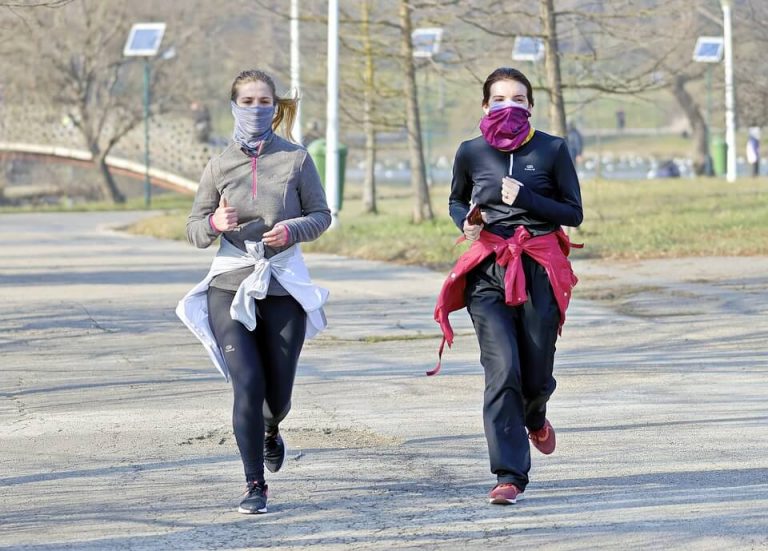 Women running with masks