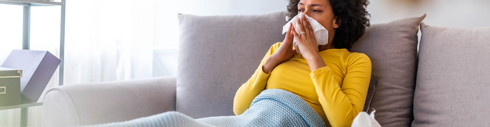 woman-flu-sneeze-tissue